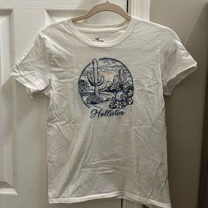 Hollister Classic T-Shirt. Size Small. White with an embroidered landscape.